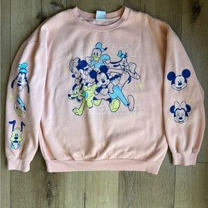 Disney Peach Graphic Sweatshirt with Blue and Yellow Accents